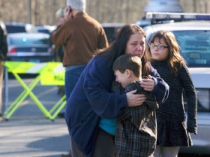 boy-shooting-comforted-sandy.n